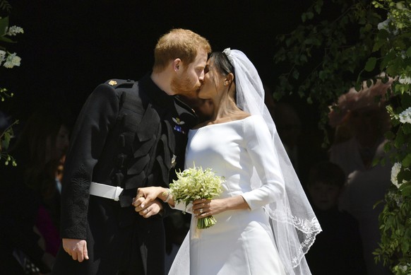 FILE - In this Saturday, May 19, 2018 file photo, Britain&#039;s Prince Harry and Meghan Markle leave after their wedding ceremony at St. George&#039;s Chapel in Windsor Castle in Windsor, near London ...