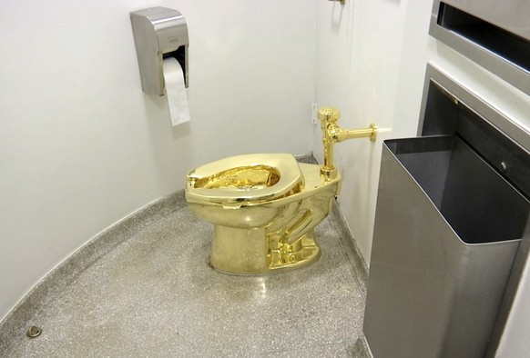 This Sept. 16, 2016 image made from a video shows the 18-karat toilet, titled &quot;America,&quot; by Maurizio Cattelan in the restroom of the Solomon R. Guggenheim Museum in New York. According to a  ...