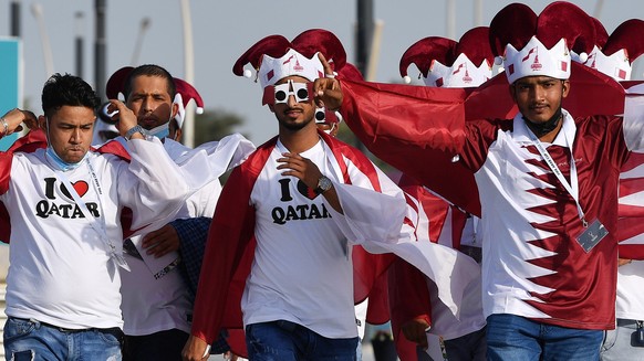 epa09618766 Fans arrive to the Education City Stadium for the FIFA Arab Cup group A soccer match between Oman and Qatar in Al-Rayyan, Qatar, 03 December 2021. EPA/Noushad Thekkayil