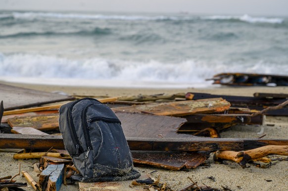 FILE - This Feb. 27, 2023 file photo shows a backpack sitting among the wrecked timbers of a migrant boat that capsized in the early morning of Sunday, Feb. 26, 2023, at a short distance from the shor ...
