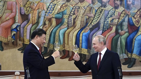 FILE - Russian President Vladimir Putin, right, and Chinese President Xi Jinping toast during their dinner at The Palace of the Facets, a building in the Moscow Kremlin, Russia, on March 21, 2023. The ...
