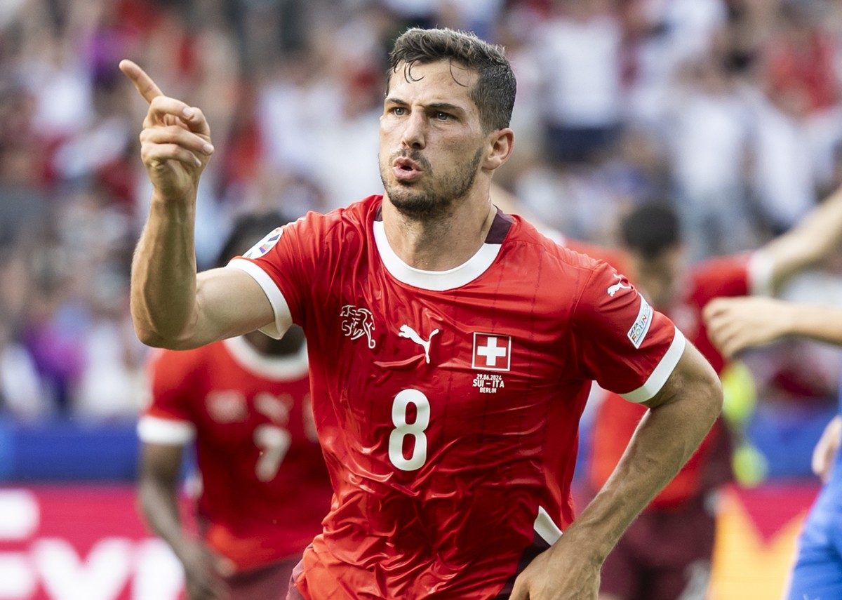 Switzerland's Remo Freuler celebrates after scoring the 1:0 during a round of 16 match between Switzerland and Italy at the Euro 2024 soccer tournament in Berlin, Germany, Saturday, June 29, 2024 ...