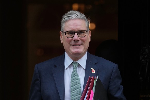 Britain&#039;s Prime Minister Keir Starmer leaves 10 Downing Street to attend the weekly Prime Ministers&#039; Questions session in parliament in London, Wednesday, Nov. 12, 2025. (AP Photo/Kin Cheung ...