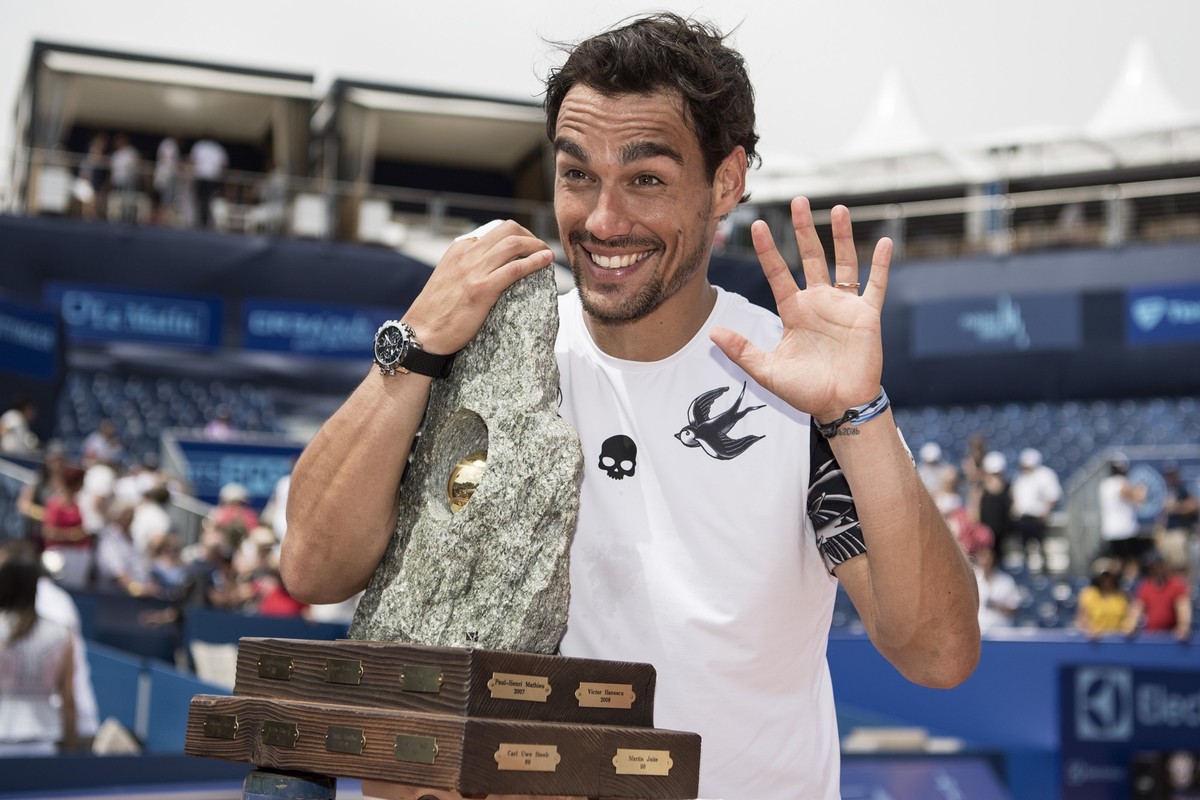 Fabio Fognini of Italy celebrates with the tophy after winning the final match against Yannick Hanfmann of Germany during the final game at the Swiss Open tennis tournament in Gstaad, Switzerland, Sun ...