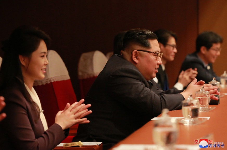 epa06641308 A picture made released by the North Korean Central News Agency (KCNA), the state news agency of North Korea, shows Respected Supreme Leader Kim Jong-un (C), together with his wife Ri Sol  ...