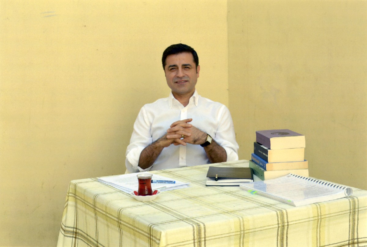 In this handout photo provided by the pro-Kurdish Peoples' Democratic Party (HDP), former co-leader of the party Selahattin Demirtas sits in prison in Turkey, Friday, May 4, 2018. The HDP announc ...
