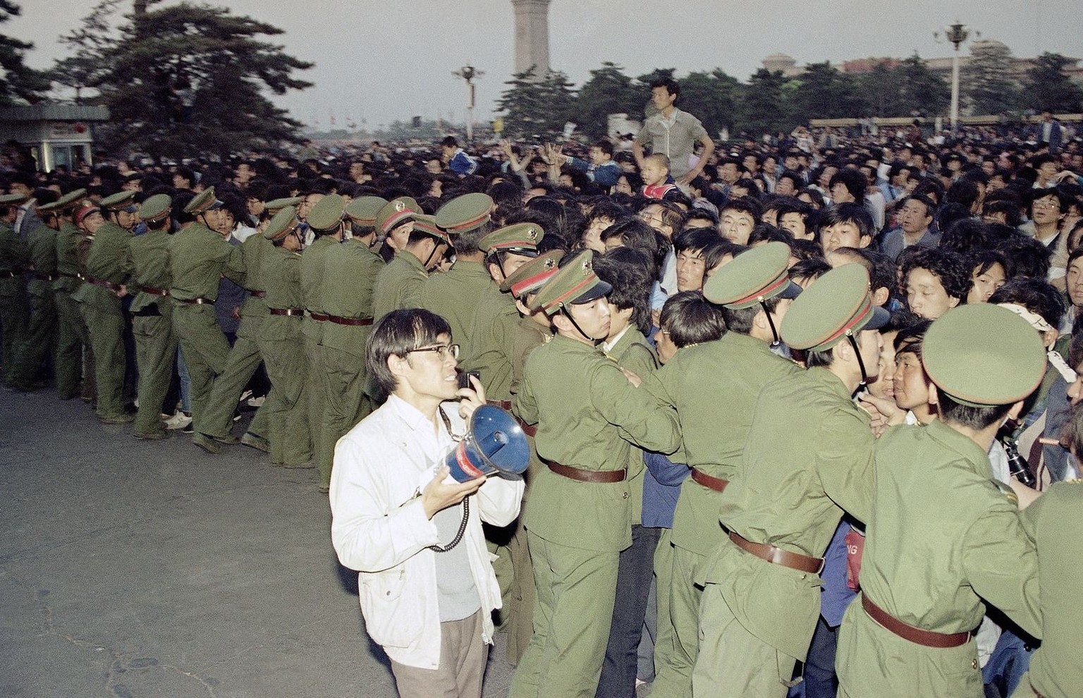 University students push against a police line in Beijing&#039;s Tiananmen Square in an attempt to get inside the Great Hall of the people during a banquet there in honor of Soviet Leader Mikhail Gorb ...