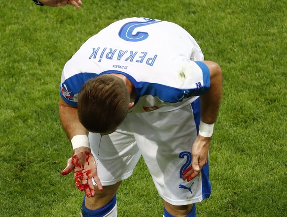 Football Soccer - Slovakia v England - EURO 2016 - Group B - Stade Geoffroy-Guichard, Saint-Etienne, France - 20/6/16 Slovakia&#039;s Peter Pekarik injured REUTERS/Max Rossi