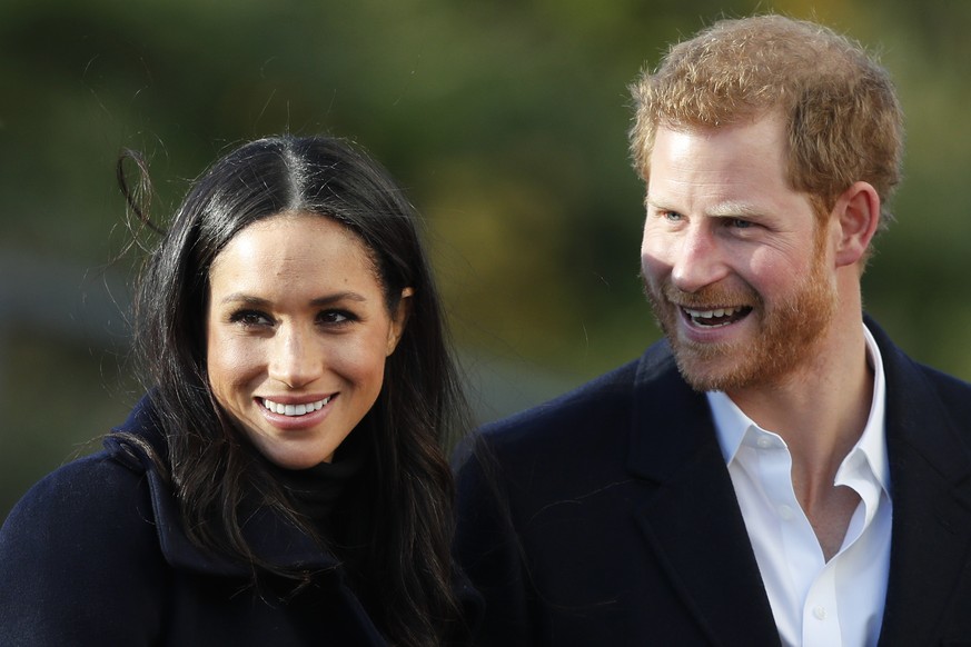 FILE - In this Dec. 1, 2017 file photo, Britain&#039;s Prince Harry and his fiancee Meghan Markle arrive at Nottingham Academy in Nottingham, England. The child of Meghan Markle and Prince Harry will  ...