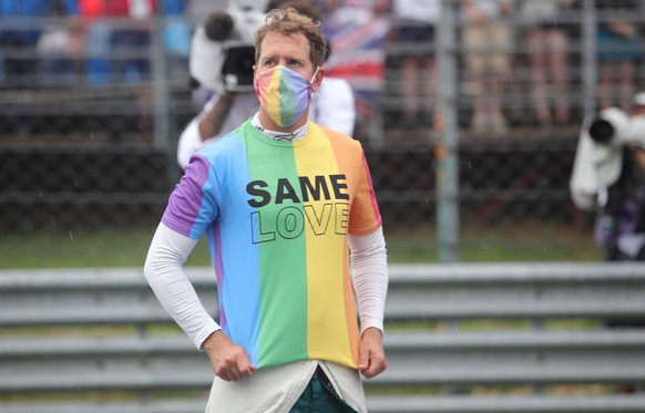 epa09385608 German Formula One driver Sebastian Vettel of the Aston Martin Cognizant F1 Team reacts at the grid prior to the Formula One Grand Prix of Hungary at the Hungaroring circuit in Mogyorod, n ...