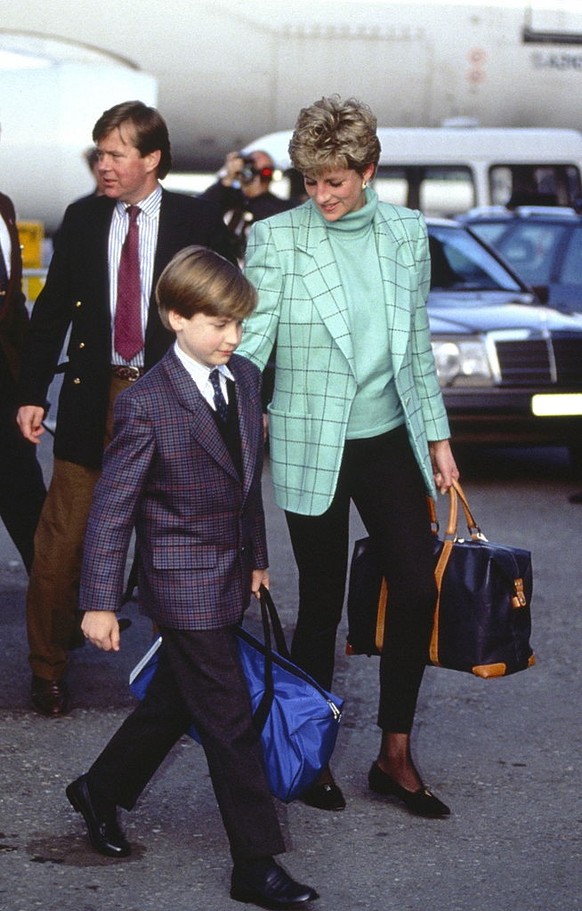 ZURICH, SWITZERLAND - MARCH 26: Diana, Princess Of Wales, Arriving With Prince William At Zurich Airport For A Ski-ing Holiday In Lech, Austria. They Are Accompanied By Bodyguard Ken Wharfe. (Photo by ...