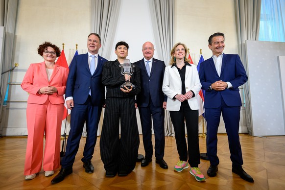 epa12116135 (L-R) Austrian State Secretary Elisabeth Zehetner, Austrian Vice-Chancellor and Minister for Arts, Culture, the Civil Service and Sport, Andreas Babler, Austrian singer-songwriter Johannes ...