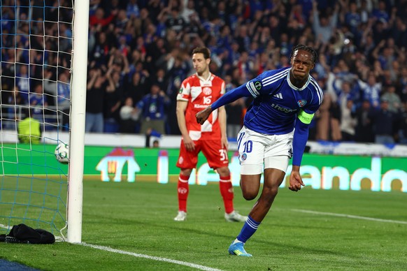Strasbourg's Emanuel Emegha celebrates after scoring his side's fourth goal during the Conference League second-leg quarterfinal soccer match between Strasbourg and FSV Mainz 05, in Strasbou ...