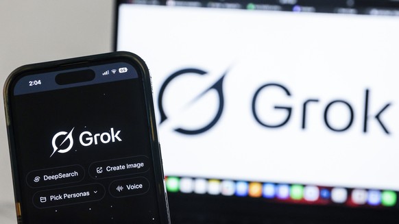 epa12644240 The Grok artificial intelligence (AI) website is displayed on a mobile phone as a nationwide restriction on the service takes effect, in Shah Alam, outside Kuala Lumpur, Malaysia 12 Januar ...