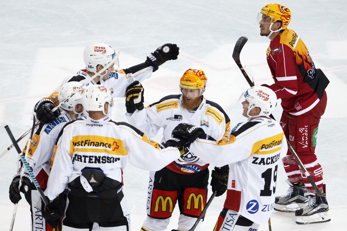 Lugano's defender Steve Hirschi #8 celebrates his goal with teammates center Tony Martensson #9, of Sweden, defender Colin Fontana #16, forward Linus Klasen, of Sweden, center, forward Patrik Zac ...