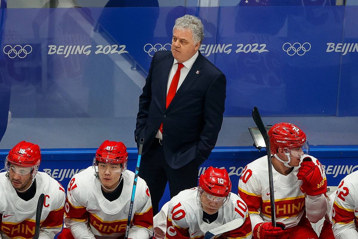 epa09744307 China's head coach Ivano Zanatta reacts during the Men's Ice Hockey preliminary round match between the USA and China at the Beijing 2022 Olympic Games in Beijing, China, 10 Febr ...
