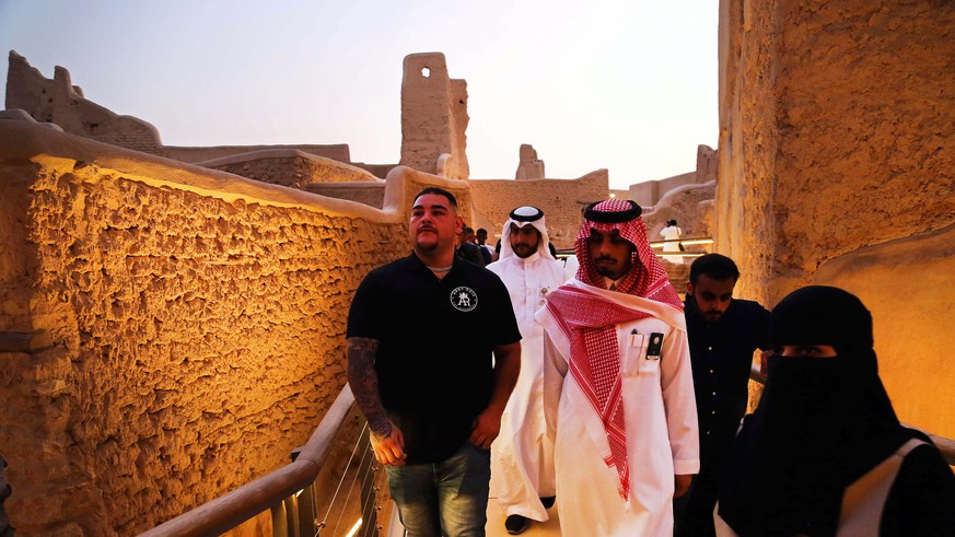 epa07817903 Defending IBF, WBA and WBO champion Andy Ruiz Jr. (L) of Mexico during his tour through the Turaif district in Diriyah, outskirts of Riyadh, Saudi Arabia, 04 September 2019. A press confer ...