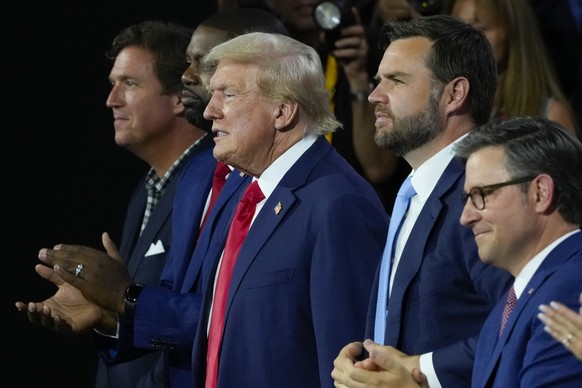 Republican presidential candidate former President Donald Trump, center, and Republican vice presidential candidate Sen. JD Vance, R-Ohio, second from the left attend the first day of the Republican N ...