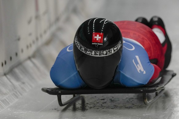 Basil Sieber, of Switzerland, slides during men&#039;s skeleton run 2 at the 2022 Winter Olympics, Thursday, Feb. 10, 2022, in the Yanqing district of Beijing. (AP Photo/Pavel Golovkin)