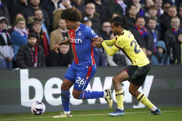 Crystal Palace&#039;s Chris Richards, left and Burnley&#039;s Lorenz Assignon vie for the ball, during the English Premier League soccer match between Crystal Palace and Burnley, at Selhurst Park, in  ...