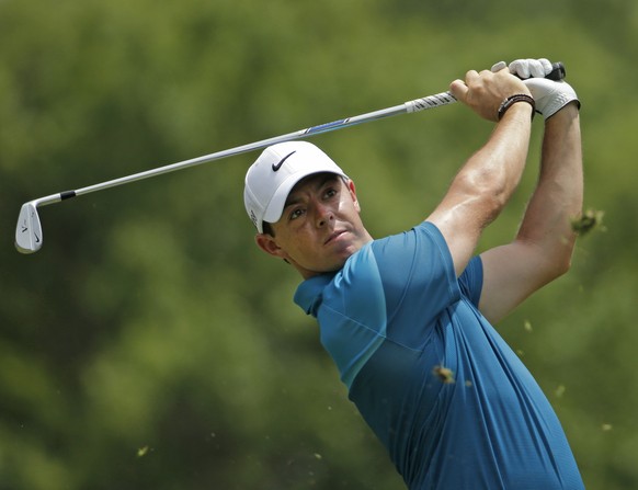 Rory McIlroy, of Northern Ireland, watches his tee shot on the second hole during the final round of the Wells Fargo Championship golf tournament at Quail Hollow Club in Charlotte, N.C., Sunday, May 1 ...