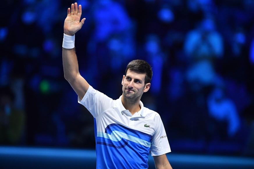epa09583627 Novak Djokovic of Serbia celebrates after defeating Casper Ruud of Norway in their group stage match of the Nitto ATP Finals tennis tournament in Turin, Italy, 15 November 2021. EPA/Alessa ...