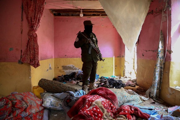 epaselect epa10466735 Taliban security officials survey the scene of an operation against alleged ISIS hideout in Kabul, Afghanistan, 14 February 2023. The Taliban government in Afghanistan has report ...