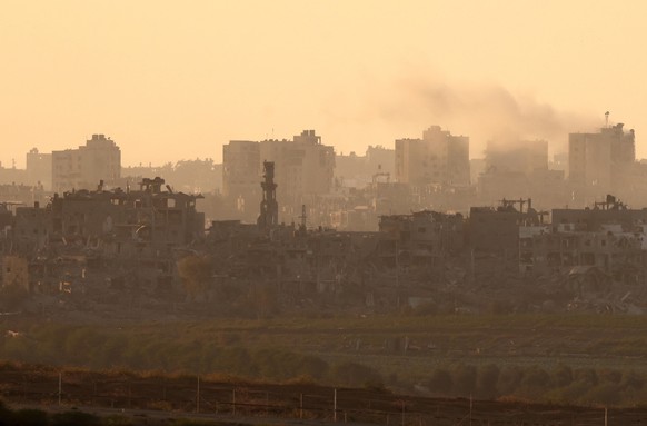 epa10968617 Smoke rising in the northern part of the Gaza Strip, seen from Sderot, Israel, November 10, 2023. More than 11,000 Palestinians and at least 1,400 Israelis have been killed, according to…