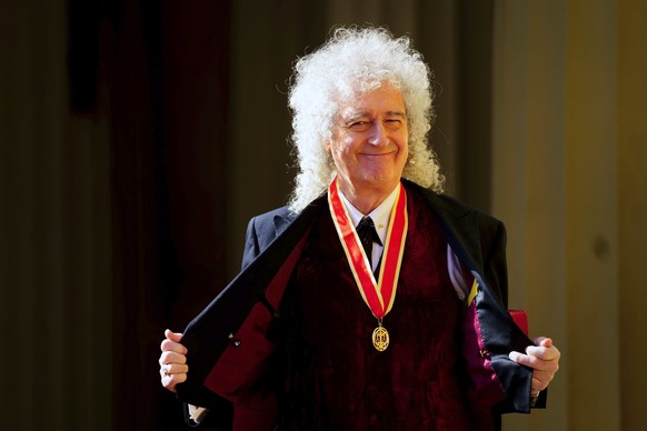Sir Brian May, musician, songwriter and animal Welfare Advocate, poses after being made a Knight Bachelor by King Charles III during an investiture ceremony at Buckingham Palace, London, Tuesday March ...
