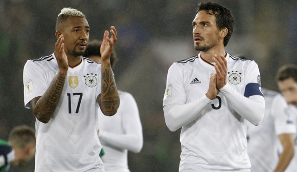 Germany&#039;s, from left, Jerome Boateng and Mats Hummels applaud their supporters after the World Cup Group C qualifying soccer match between Northern Ireland and Germany at Windsor Park in Belfast, ...