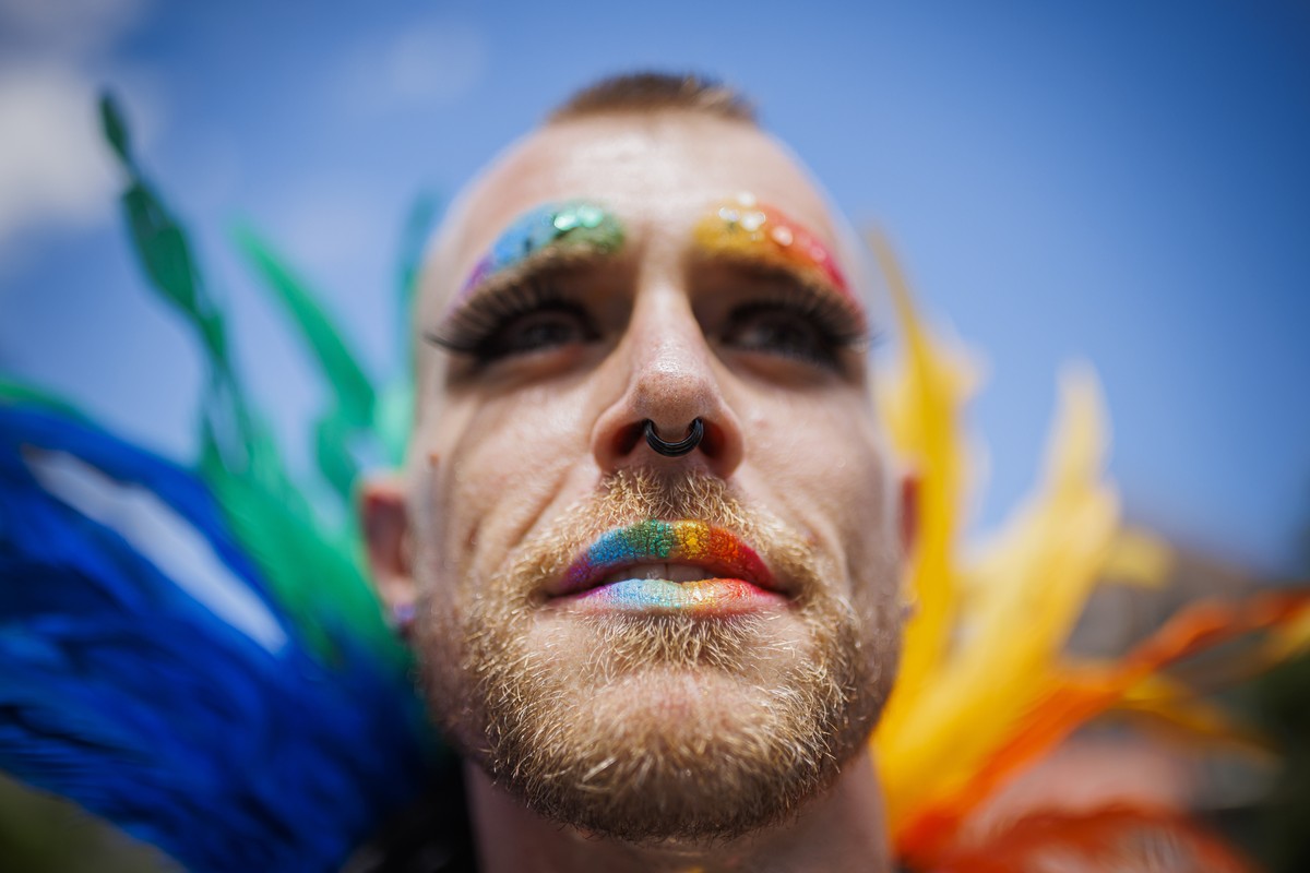 epa10033597 People celebrate in the street during a Pride march at the Bulle Pride in Bulle, Switzerland, 25 June 2022. Under the title 'Pride in Bulle - It's right now!!' the festival  ...