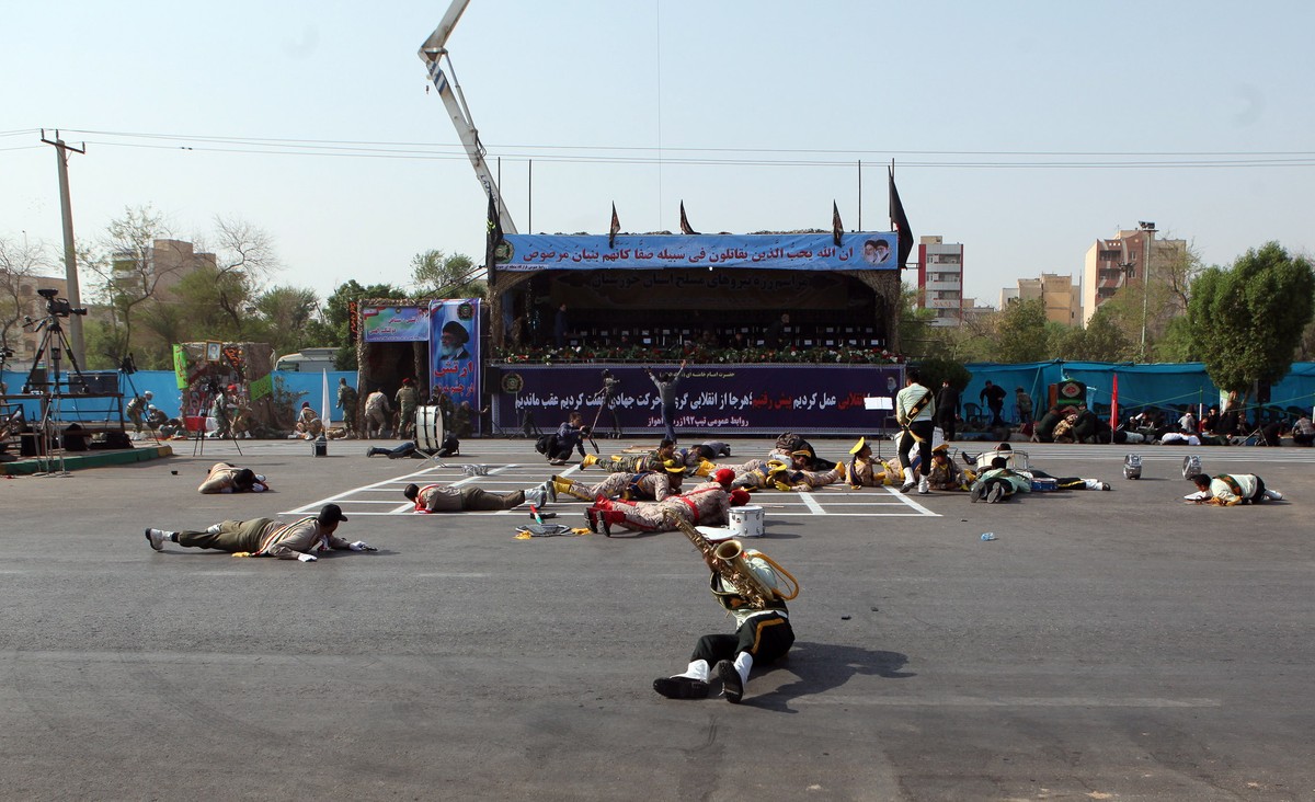 epa07038534 Iranian soldiers on the ground as a terror attack take place during a military parade in the city of Ahvaz, southern, Iran, 22 September 2018. Media reported that Gunmen have opened fire d ...