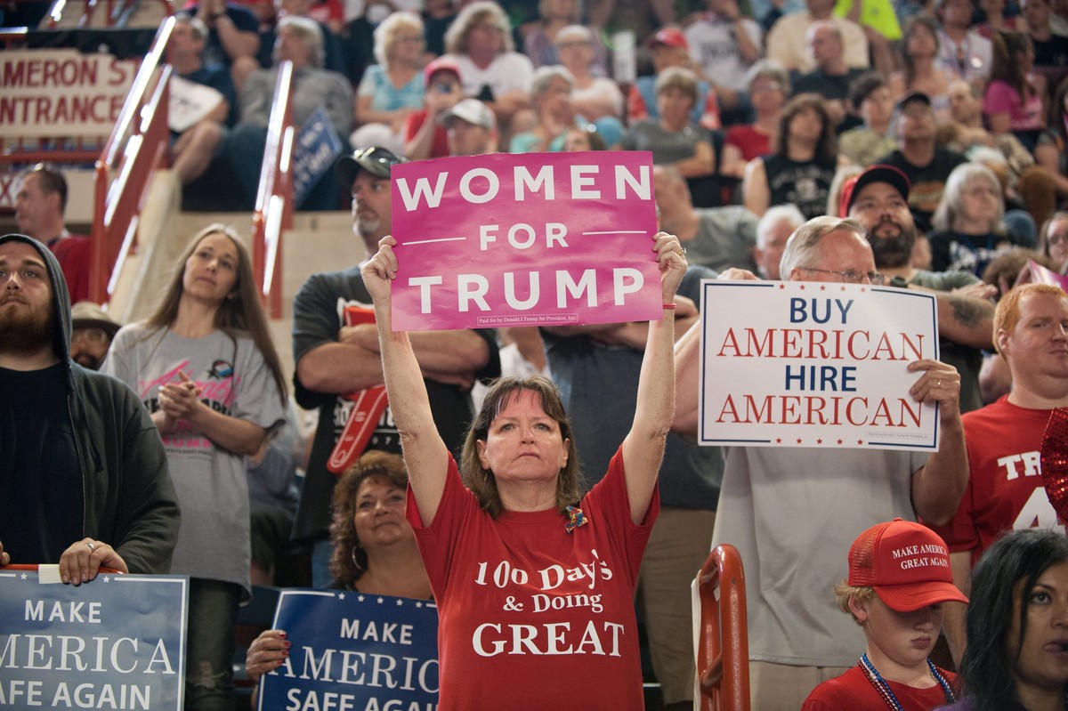 epa05936316 A supporter of US President Donald J. Trump holds up a 'Women for Trump' banner during a rally at the Pennsylvania Farm Show Complex in Harrisburg, Pennsylvania, USA, 29 April 20 ...