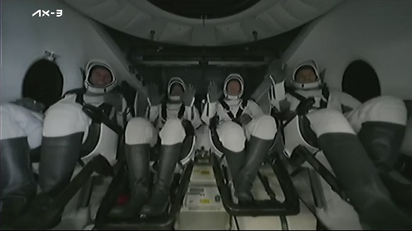 This photo from Axiom Space shows astronauts giving a thumbs up after the SpaceX capsule was dropped into the Atlantic Ocean and placed aboard a recovery vessel for the…