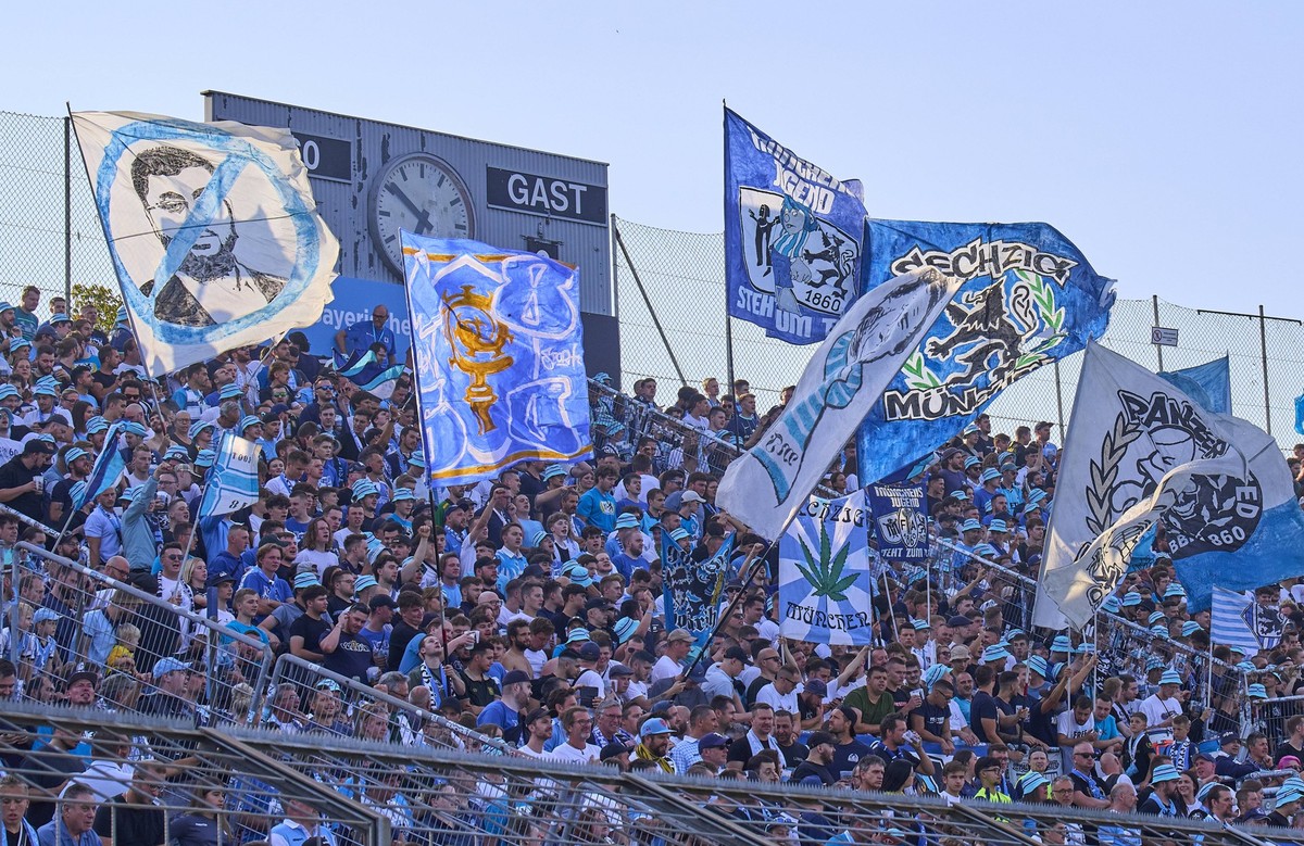 TSV 1860 fans with flag against Aufsichtsratsvorsitzender Hauptsponsor Hasan Ismaik TSV 1860 at the 3.Liga match TSV 1860 M