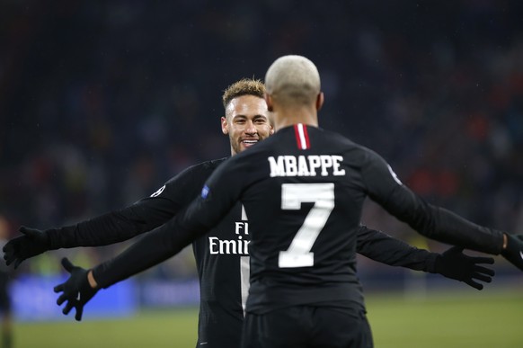 PSG Kylian Mbappe celebrates with teammate Neymar his side&#039;s fourth goal during the Champions League group C soccer match between Red Star and Paris Saint Germain, in Belgrade, Serbia, Tuesday, D ...