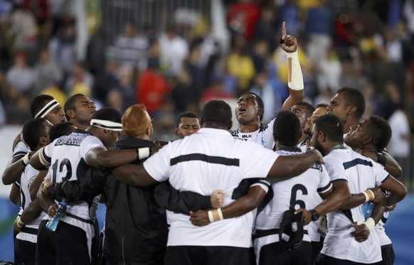 2016 Rio Olympics - Rugby - Men&#039;s Gold Medal Match - Fiji v Great Britain - Deodoro Stadium - Rio de Janeiro, Brazil - 11/08/2016. Fiji players celebrate at the end of their match. REUTERS/Phil N ...