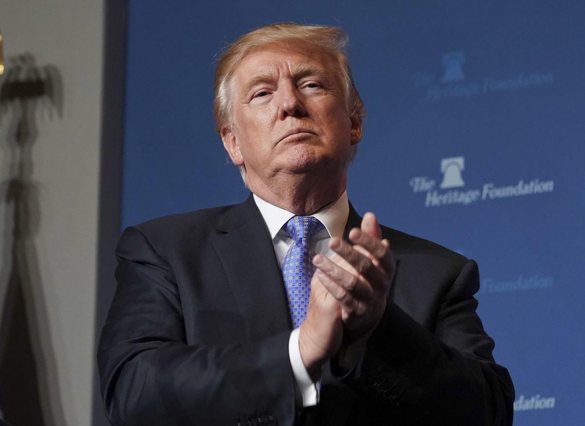 President Donald Trump applauds members of the audience before speaking at the Heritage Foundation's annual President's Club meeting, Tuesday, Oct. 17, 2017 in Washington. (AP Photo/Pablo Ma ...
