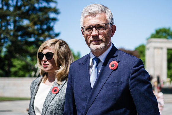 epa09933654 Ukrainian ambassador to Germany Andrij Melnyk (R) and his wife Svitlana Melnyk (L) leave after a wreath laying ceremony at the Soviet War Memorial at Tiergarten park in Berlin, Germany, 08 ...