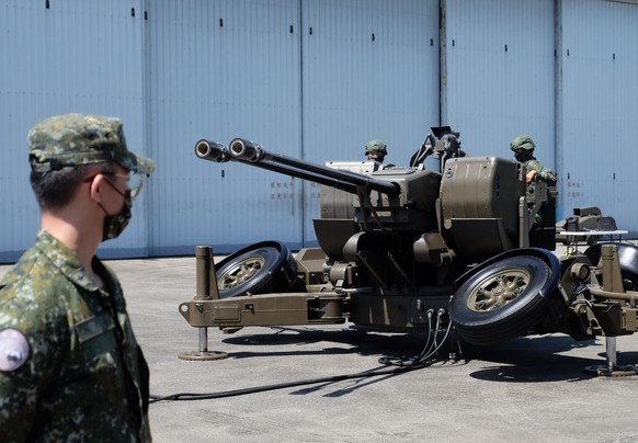 Taiwanese soldiers operate a Oerlikon 35mm twin cannon anti-aircraft gun at a base in Taiwan&#039;s southeastern Hualien county on Thursday, Aug. 18, 2022. Taiwan is staging military exercises to show ...