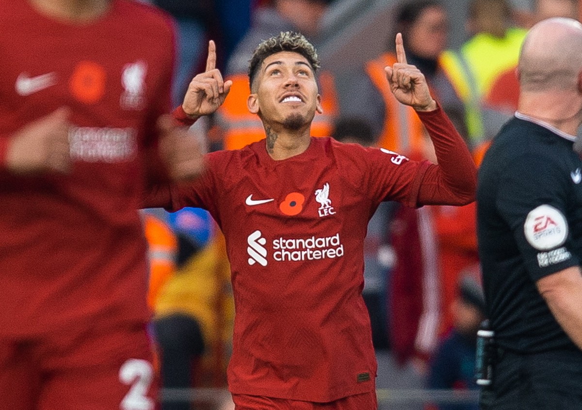 epa10301836 Liverpool's Roberto Firmino celebrates after scoring the first goal during the English Premier League soccer match between Liverpool and Southampton at Anfield in Liverpool, Britain,  ...