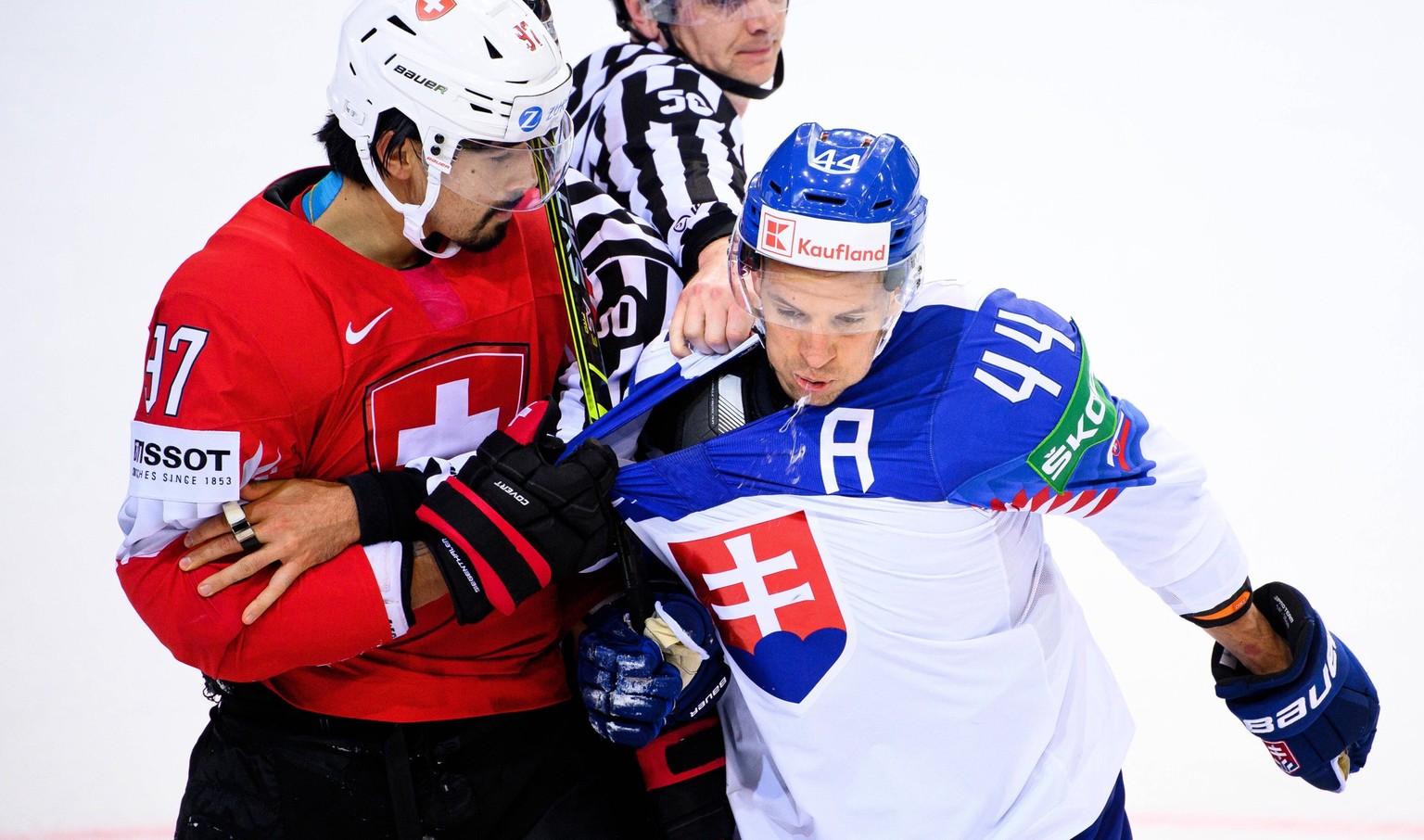 210527 Jonas Siegenthaler of Switzerland and Mislav Rosandic of Slovakia during the 2021 IIHF Ice hockey, Eishockey World Championship, WM, Weltmeisterschaft game between Switzerland and Slovakia on M ...