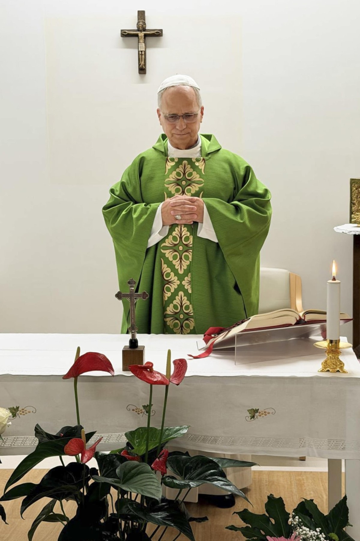 epa13309336 A handout photo made available by the Vatican Media Press Office shows Pope Leo XIV (R) celebrating Mass in the hall set up on the 10th floor of the Gemelli Polyclinic in Rome, Italy, 16 O ...