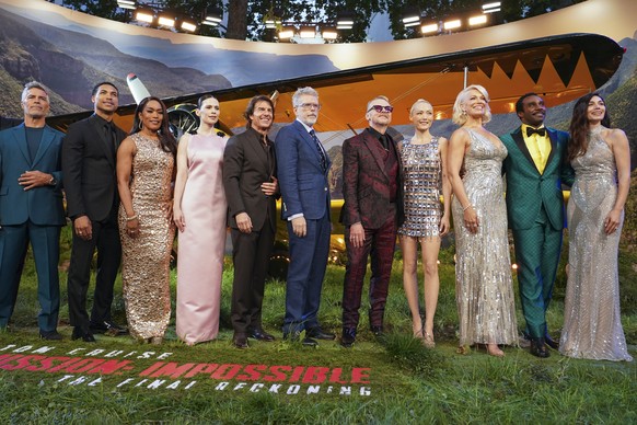 Esai Morales, from left, Greg Tarzan Davis, Angela Bassett, Hayley Atwell, Tom Cruise, director Christopher McQuarrie, Simon Pegg, Pom Klementieff, Hannah Waddingham, Tramell Tillman, and Mariela Garr ...