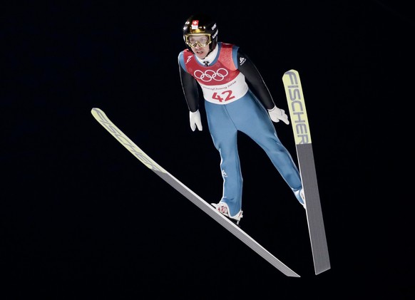 Simon Ammann, of Switzerland, soars through the air during the men&#039;s normal hill individual ski jumping qualifier ahead of the 2018 Winter Olympics in Pyeongchang, South Korea, Thursday, Feb. 8,  ...