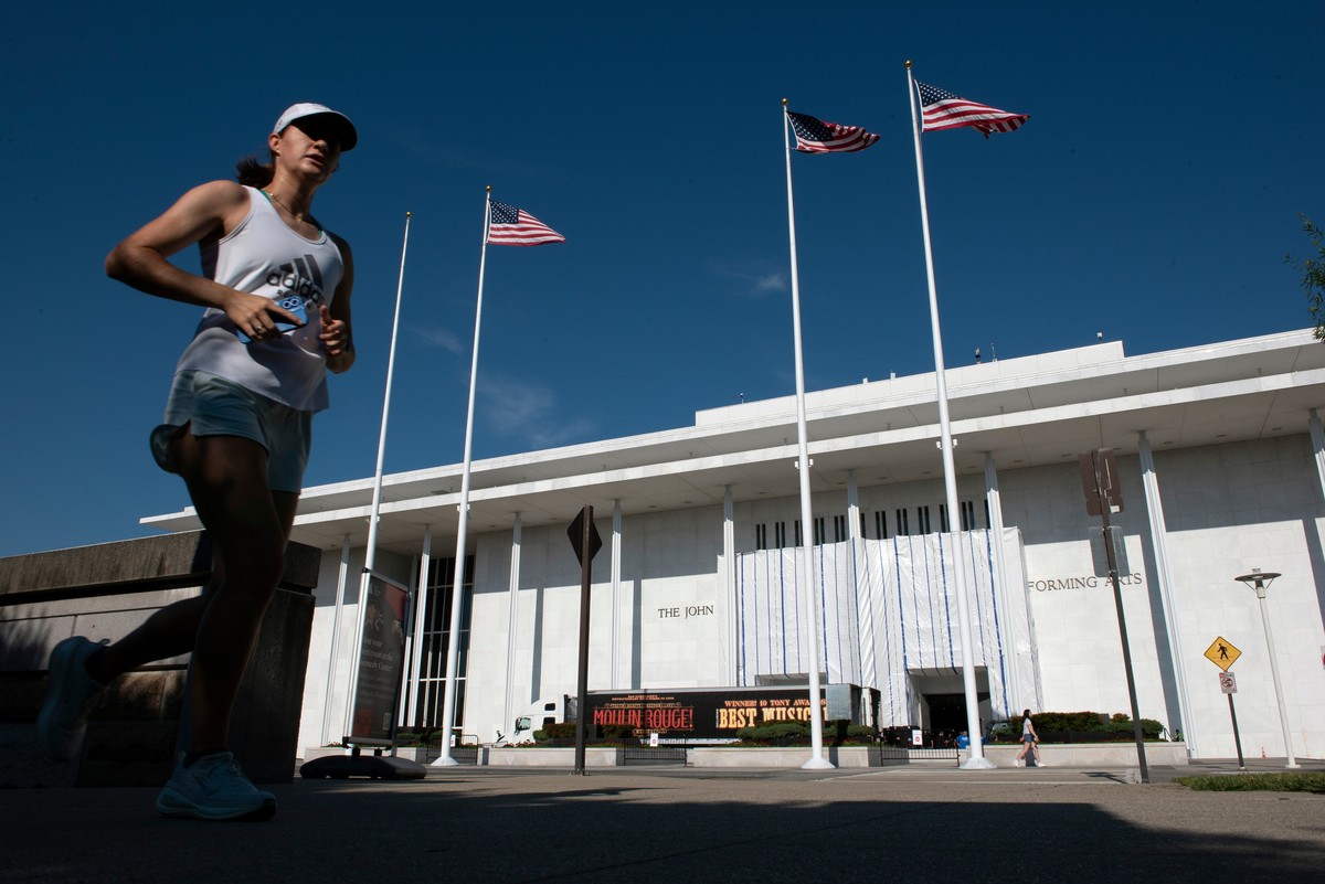 A woman jogs past The John F. Kennedy Center for Performing Arts where tarps cover the name on the exterior wall, in Washington, Wednesday, June 17, 2026. (AP Photo/Cliff Owen)
Trump Kennedy Center