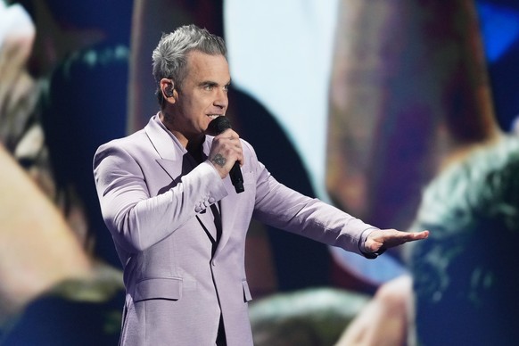 Singer Robbie Williams performs during the draw for the 2026 soccer World Cup at the Kennedy Center in Washington, Friday, Dec. 5, 2025. (AP Photo/Stephanie Scarbrough, Pool)
WCup Draw Soccer
