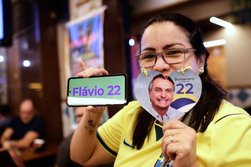 A supporter of opposition presidential candidate Sen. Flavio Bolsonaro poses for a picture as she waits for election results in Rio de Janeiro, Sunday, Oct. 4, 2026. (AP Photo/Bruna Prado)
Brazil Elec ...