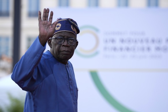 epa10707566 Bola Tinubu, President of Nigeria, arrives for the closing session of the New Global Financial Pact Summit, Paris, France, 23 June 2023. The two-day summit aimed at seeking better response ...