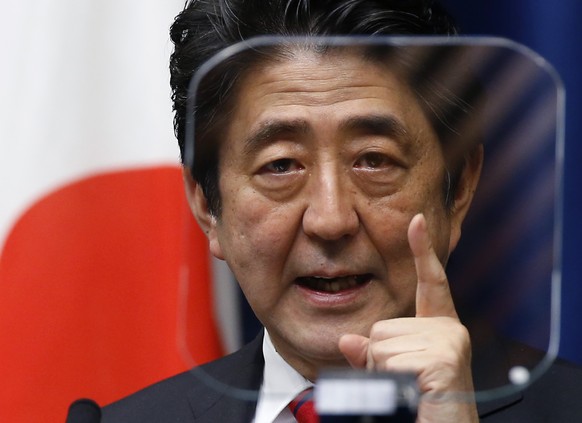 FILE - Japanese Prime Minister Shinzo Abe speaks during a press conference at his official residence in Tokyo on March 20, 2014. Former Japanese Prime Minister Abe, a divisive arch-conservative and on ...